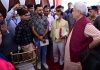Lt Governor Manoj Sinha interacts with Shri Amarnathji pilgrims and volunteers at transit camp of Pantha Chowk in Srinagar on Sunday.