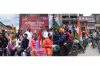 BJP leaders Tarun Chug, Tejasvi Surya and Ravinder Raina (left) during ‘Tiranga Bikers Rally’ (right) at Lal Chowk in Srinagar on Monday. —Excelsior/Shakeel