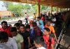 Pilgrims waiting for registration in front of counter at Railway Station in Jammu on Thursday.