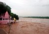 Flooded Chenab river flowing above danger mark at Akhnoor on Thursday. -Excelsior/Rakesh