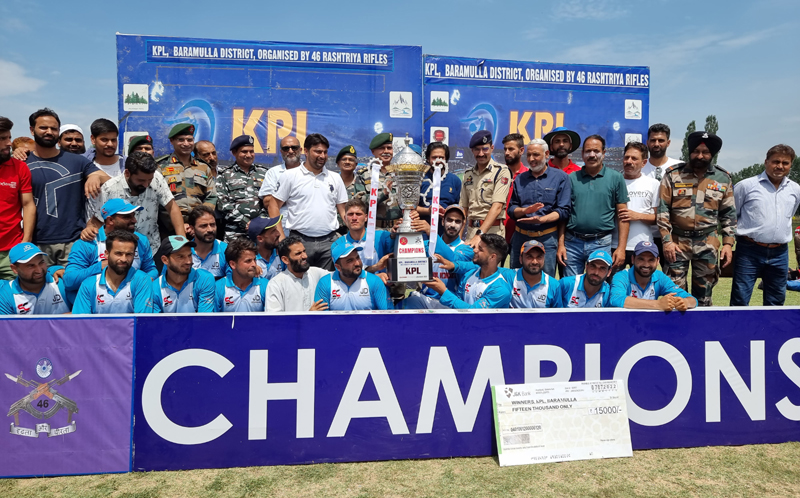 Victorious team holding trophy while posing for a group photograph with dignitaries at Baramulla on Thursday. Victorious team holding trophy while posing for a group photograph with dignitaries at Baramulla on Thursday.