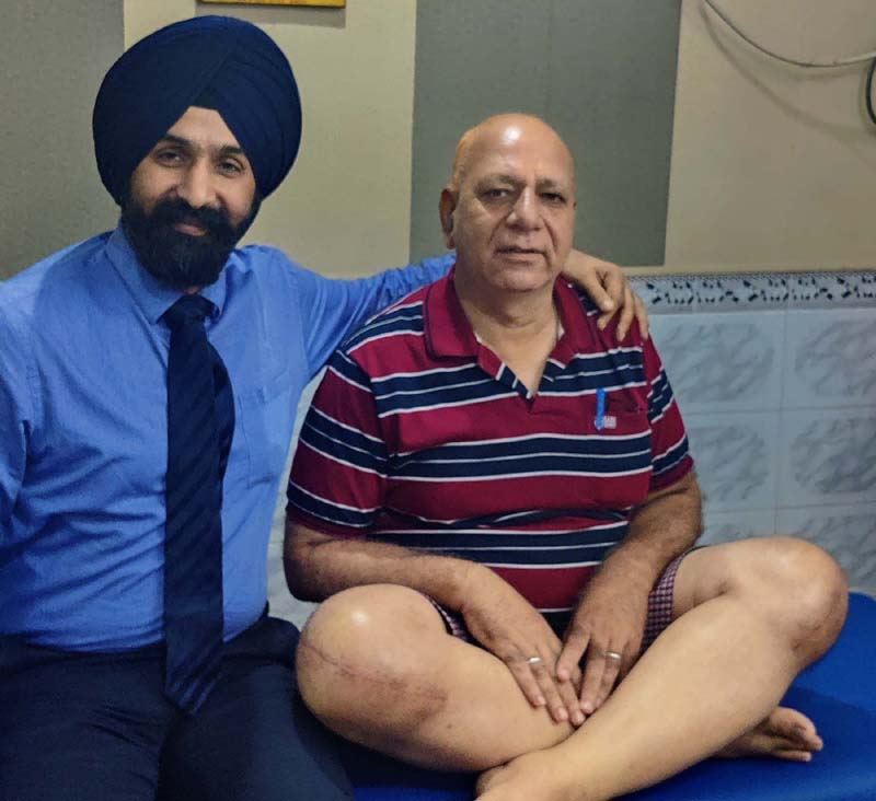 Dr Ranjit Singh posing with a patient on whom he performed both knees replacement surgery. Dr Ranjit Singh posing with a patient on whom he performed both knees replacement surgery.