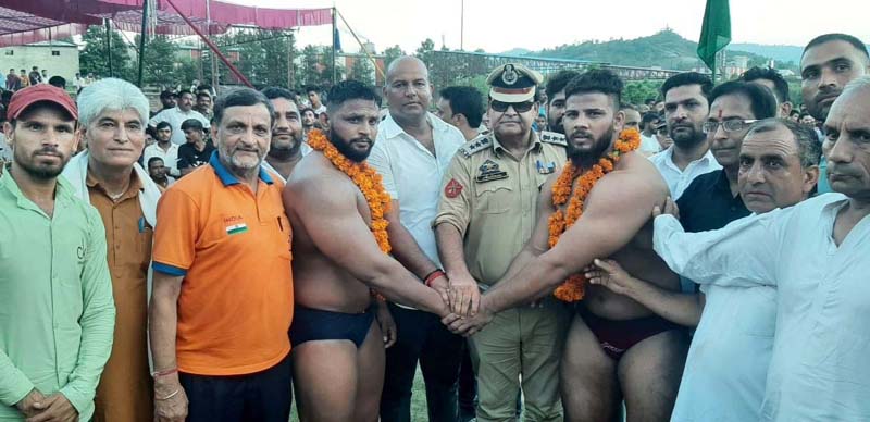 Wrestlers being introduced by the dignitaries at Udhampur on Tuesday. Wrestlers being introduced by the dignitaries at Udhampur on Tuesday.