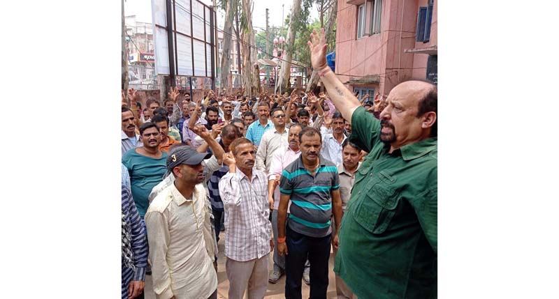 PHE workers staging protest demonstration at Udhampur on Tuesday. PHE workers staging protest demonstration at Udhampur on Tuesday.