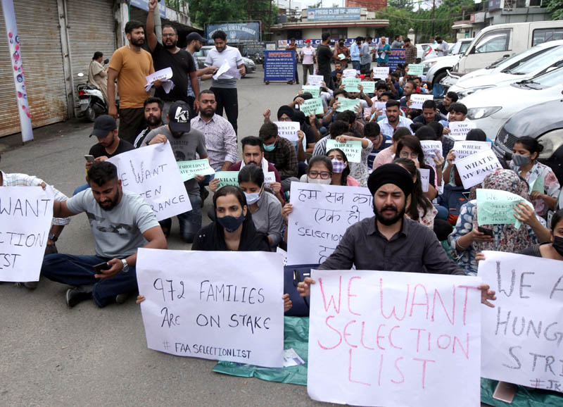 FAA aspirants staging sit-in protest outside Press Club, Jammu on Friday. —Excelsior/Rakesh FAA aspirants staging sit-in protest outside Press Club, Jammu on Friday. —Excelsior/Rakesh