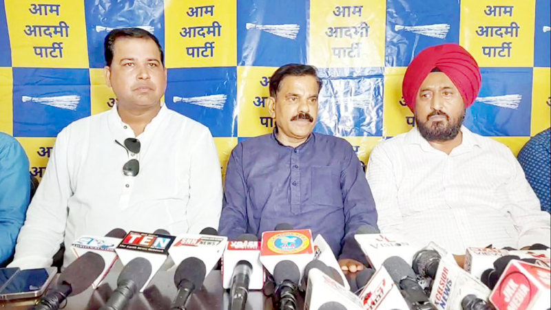 AAP leader, Harsh Dev Singh flanked by others addressing press conference in Jammu on Tuesday. AAP leader, Harsh Dev Singh flanked by others addressing press conference in Jammu on Tuesday.