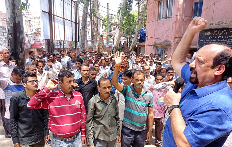 PHE workers protesting at Udhampur on Monday.