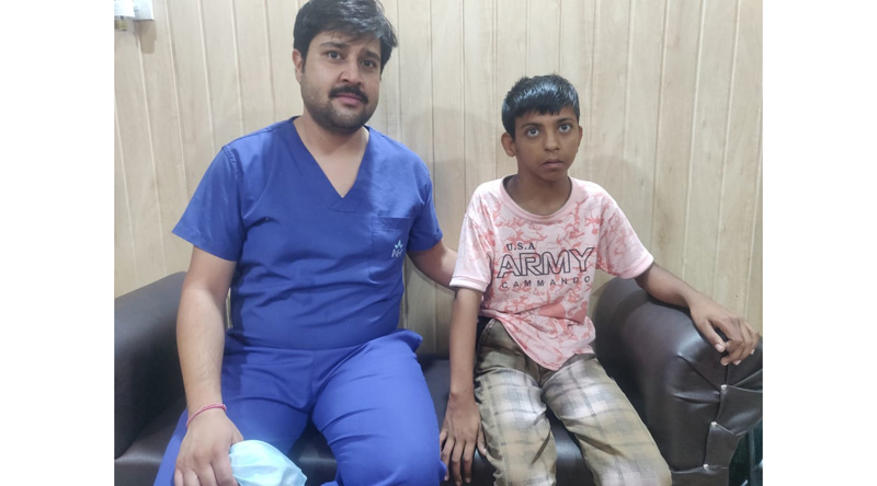 Dr Arjun Malhotra posing with a child to whom he operated successfully for 'Silver-Russell- Syndrome'. Dr Arjun Malhotra posing with a child to whom he operated successfully for 'Silver-Russell- Syndrome'.