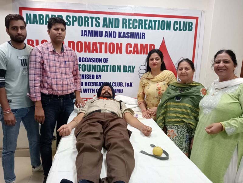 A volunteer donating blood at a camp on NABARD Foundation Day. A volunteer donating blood at a camp on NABARD Foundation Day.