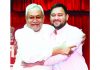 Bihar Chief Minister Nitish Kumar greet Deputy Chief Minister Tejashwi Yadav after taking oath of office at Raj Bhawan, in Patna on Wednesday. (UNI)