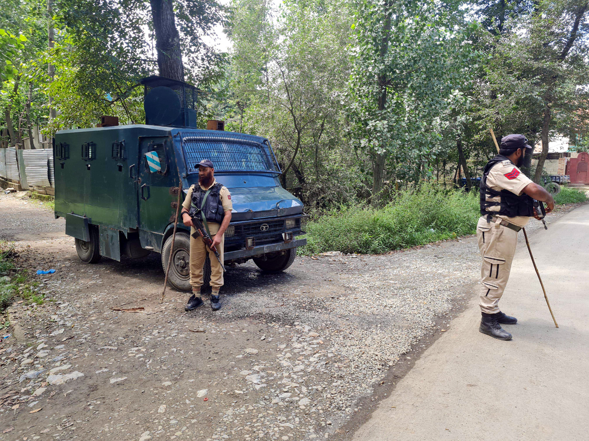 Troops at the site of encounter at Redwani, Kulgam on Friday. — Excelsior / Sajad Dar