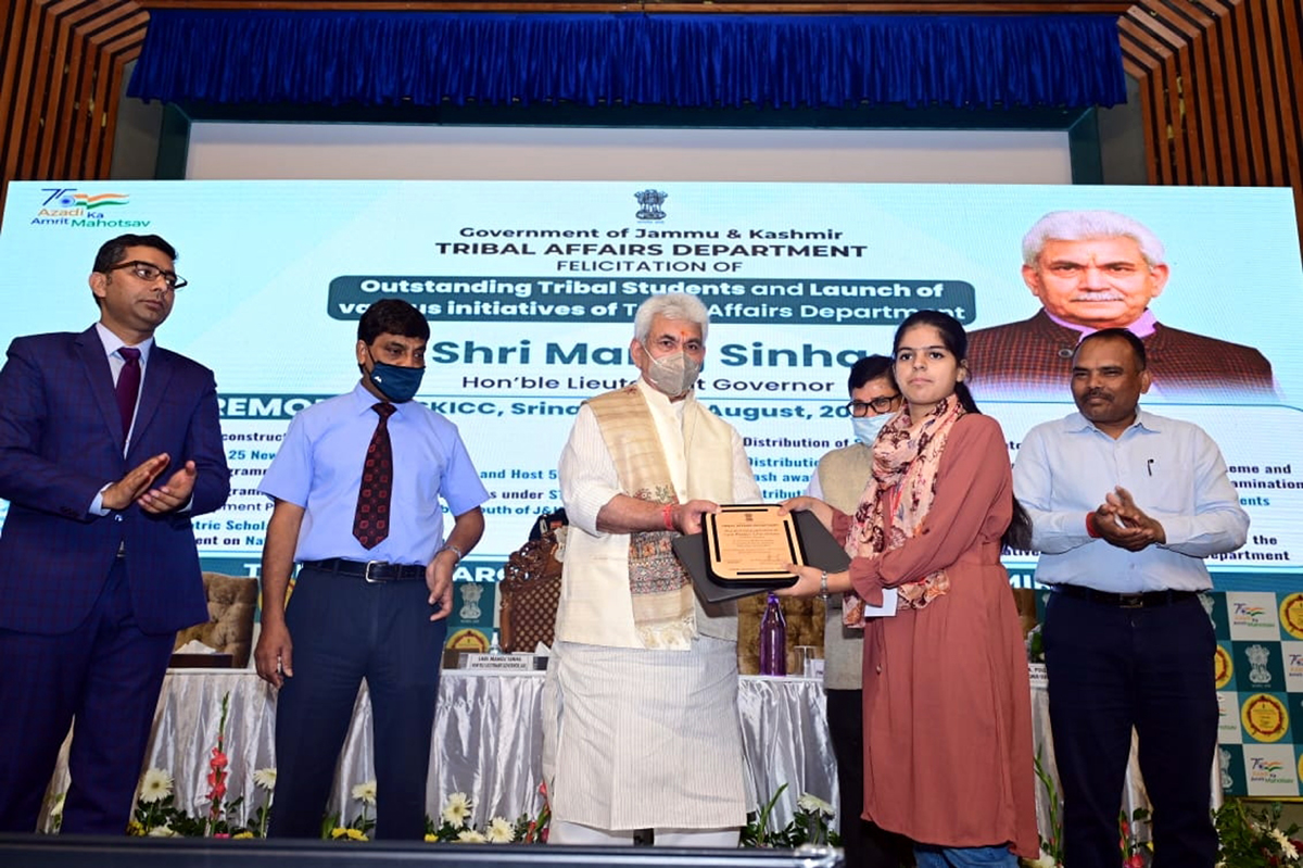 Lt Governor felicitating a tribal student at a function in Srinagar on Friday. Lt Governor felicitating a tribal student at a function in Srinagar on Friday.