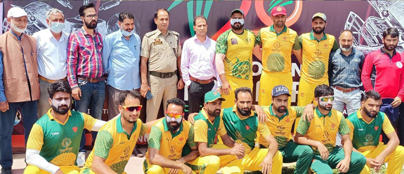 ADC, Waseem Raja posing for a group photograph alongwith players and others at Bandipora on Monday.