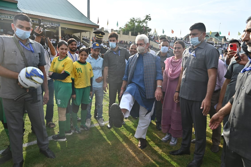 Lt Governor Manoj Sinha testing his soccer skills while dedicating the Upgraded & Revamped Bakshi Stadium at Srinagar to the Sportspersons of J&K on Friday.