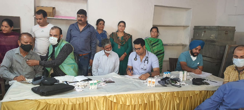 HoD Cardiology GMC & SSH Jammu Dr Sushil Sharma examining patients at R N Pura in Jammu on Sunday. HoD Cardiology GMC & SSH Jammu Dr Sushil Sharma examining patients at R N Pura in Jammu on Sunday.