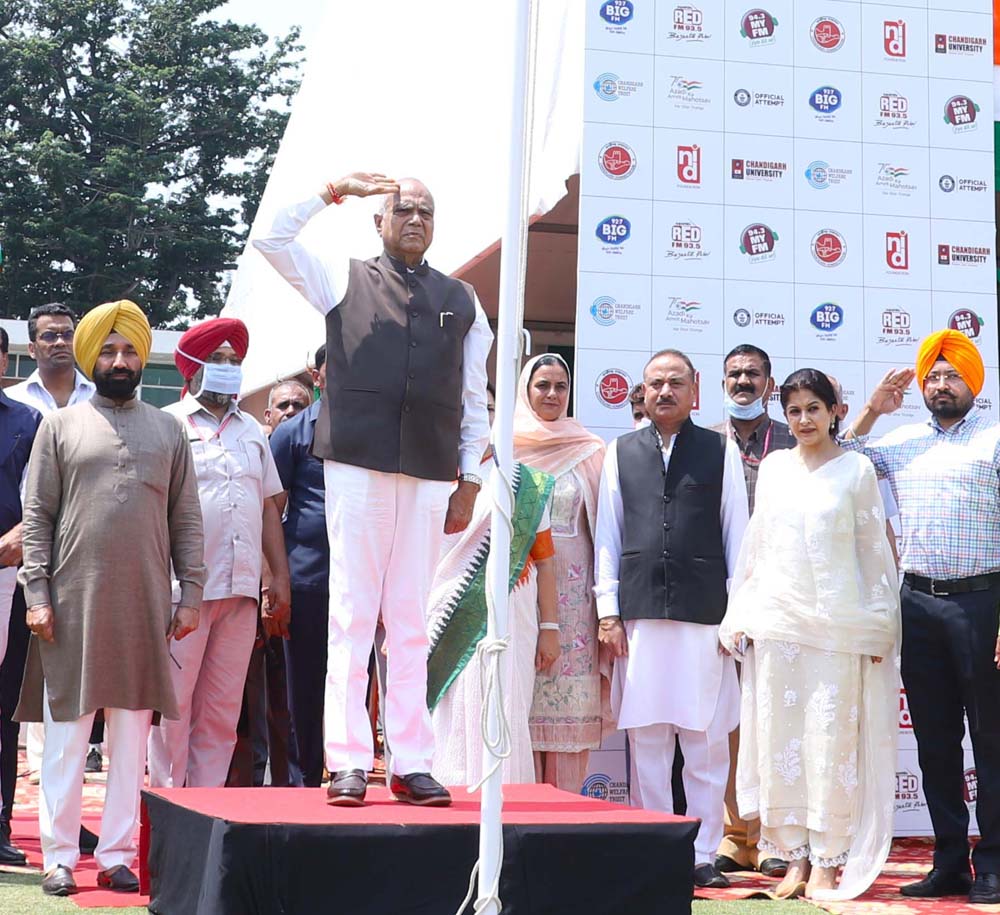 Punjab Governor and Chandigarh UT Administrator Banwarilal Purohit taking salute during flag hoisting ceremony at Chandigarh Cricket Stadium.