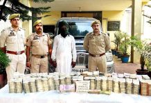 Udhampur police team with arrested accused and cash seized from him.