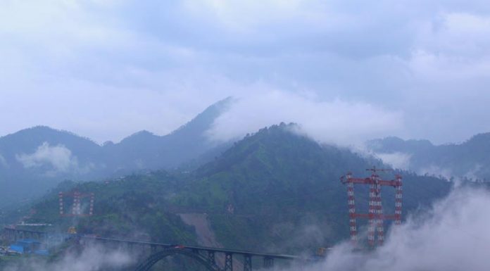 Panoramic view of world’s highest Chenab rail bridge under the clouds at Kauri in Reasi district. -Excelsior/Rakesh