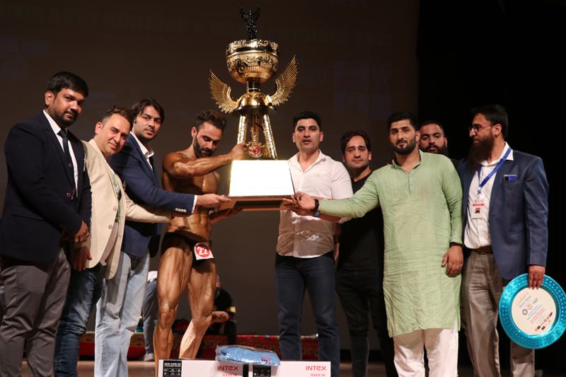 A winner being awarded with trophy by dignitaries at Srinagar on Sunday. A winner being awarded with trophy by dignitaries at Srinagar on Sunday.