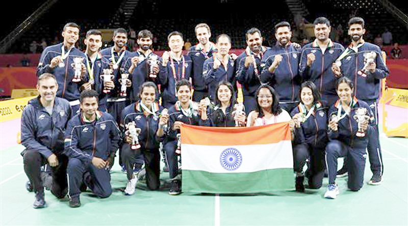 Team India celebrate winning the silver medal in Badminton team event. Team India celebrate winning the silver medal in Badminton team event.