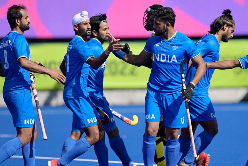 Indian Hockey players celebrating victory over Canada.