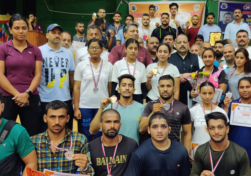 Winners displaying medals while posing for a group photograph with BJP leader Devender Singh Rana and other dignitaries at University of Jammu on Sunday. Winners displaying medals while posing for a group photograph with BJP leader Devender Singh Rana and other dignitaries at University of Jammu on Sunday.