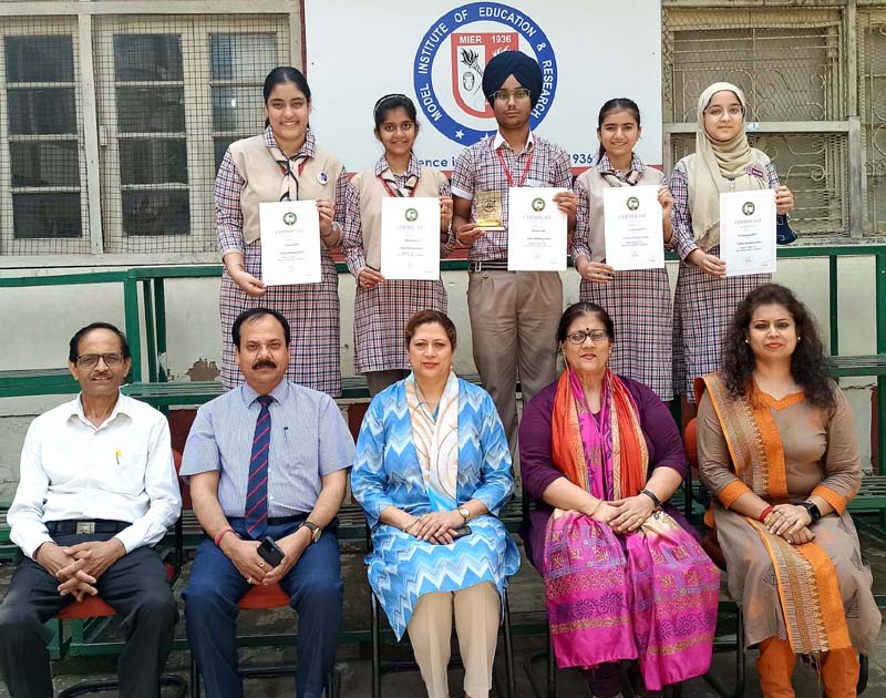 Participants displaying certificates while posing with Management of Model Academy Jammu.