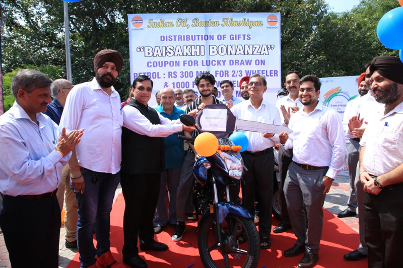 Dignitaries presenting motor bike to winner of 'Baisakhi Bonanza' scheme. Dignitaries presenting motor bike to winner of 'Baisakhi Bonanza' scheme.