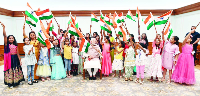 Girls tie Rakhi to Prime Minister Narendra Modi on the occasion of Rakshabandhan festival in New Delhi on Thursday.