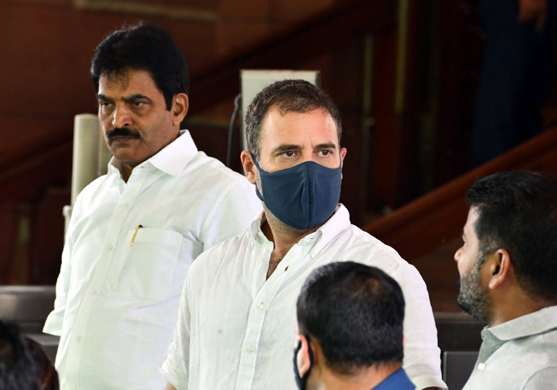 Congress MPs Rahul Gandhi and K C Venugopal at Parliament House during the Monsoon Session in New Delhi on Thursday. (UNI)