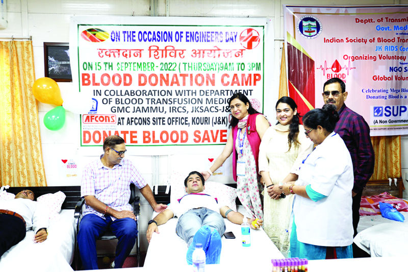 Donors and dignitaries during blood donation camp.