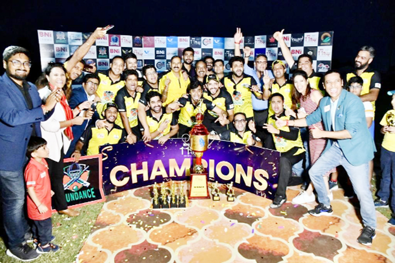 Winners celebrating victory while posing for group photograph along with trophy at MA Stadium on Sunday.