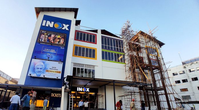 Labourers busy giving finishing touches to Multiplex cinema at Shivpora in Srinagar on Monday. - Excelsior/Shakeel