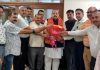 Senior BJP leader Devender Singh Rana and others posing for photograph.