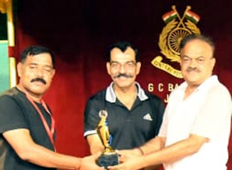 A winner being awarded with trophy by the chief guest TN Khutiya, DIGP CRPF J&K Zone at Jammu on Sunday. A winner being awarded with trophy by the chief guest TN Khutiya, DIGP CRPF J&K Zone at Jammu on Sunday.