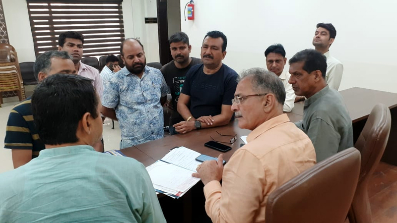 Sr BJP leader Kavinder Gupta listening public grievances at Jammu on Tuesday. Sr BJP leader Kavinder Gupta listening public grievances at Jammu on Tuesday.