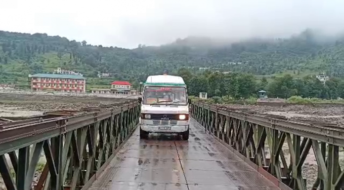 Ambulance carrying body of Pak militant crossing Chakan Da Bagh in Poonch on Monday.
