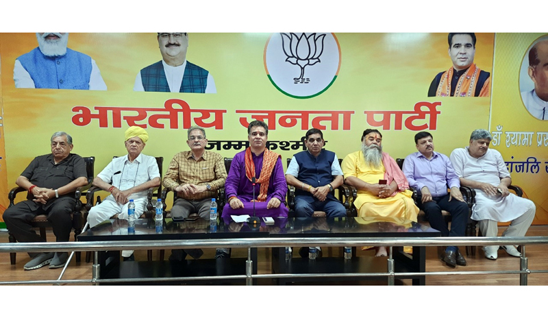 BJP President Ravinder Raina and leaders of various organizations on stage during a meeting in Jammu on Wednesday.