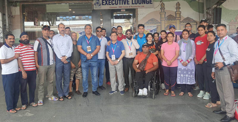 Chef-De-Mission, Nirmolak Singh along with J&K contingent at Ahmedabad Railway Station in Gujarat on Wednesday.