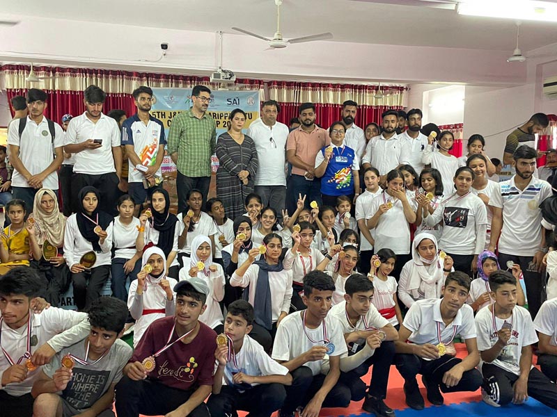 Winners displaying medals while posing for a group photograph at Jammu. Winners displaying medals while posing for a group photograph at Jammu.