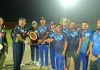A player being awarded with a trophy by the organisers at MA Stadium Jammu on Wednesday.