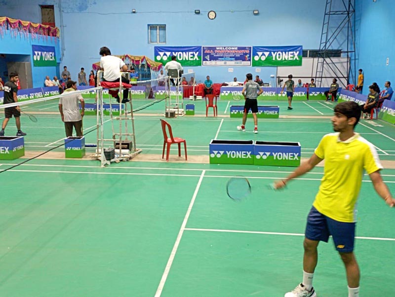 A player in action during a Badminton match at MA Stadium in Jammu on Saturday.