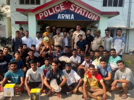 SHO Arnia, Sumeet Sharma along with Police officials and youth posing for a group photograph at Arnia in Jammu on Wednesday.