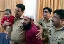 SSP Kishtwar Shafqat Hussain Batt reuniting recovered child with his father.