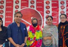 JKNC Chief Spokesperson Tanvir Sadiq and Women's Wing functionaries posing for group photograph.