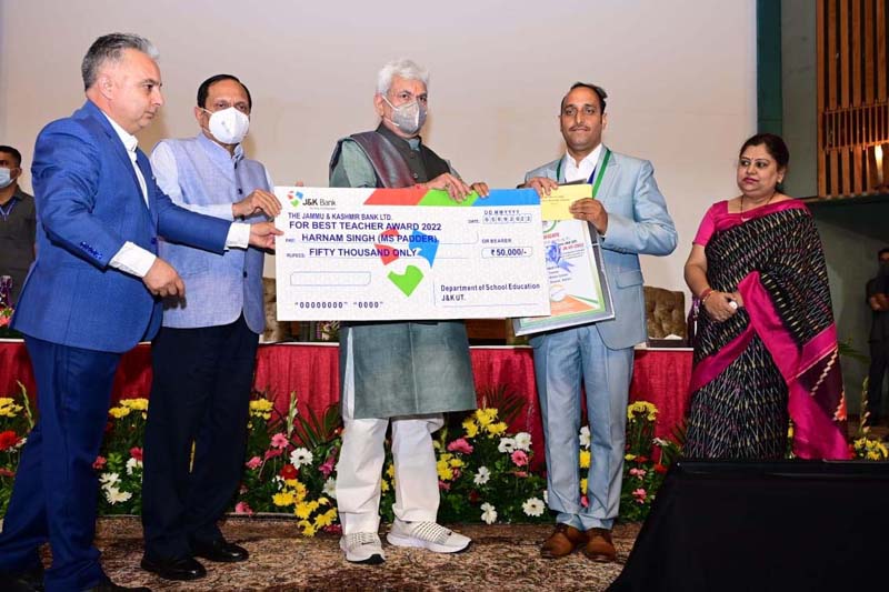 LG Manoj Sinha felicitating teacher at SKICC Srinagar. LG Manoj Sinha felicitating teacher at SKICC Srinagar.
