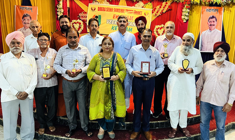 MP Jugal Kishore Sharma and BJP leader Baldev Singh Billawaria posing with poets during a Kavi Sammelan in Jammu. MP Jugal Kishore Sharma and BJP leader Baldev Singh Billawaria posing with poets during a Kavi Sammelan in Jammu.