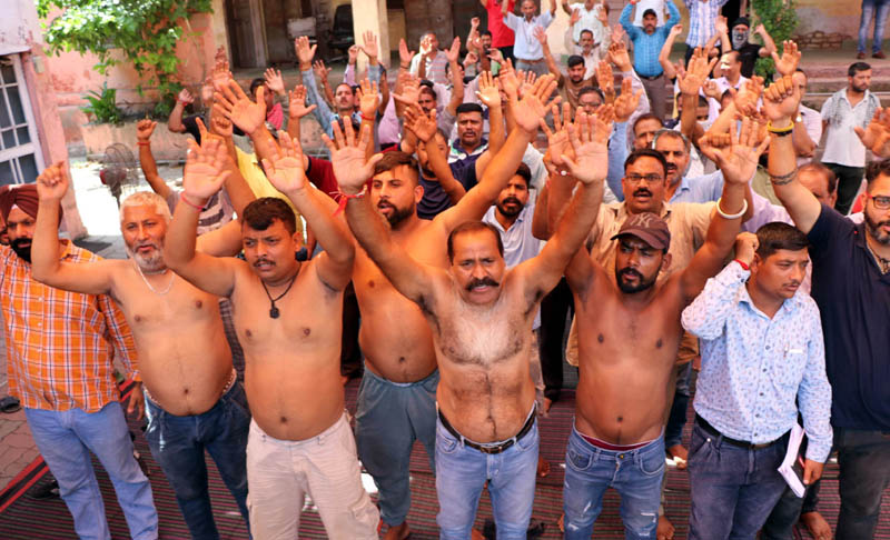 PHE workers staging protest demonstration outside Chief Engg’s office at BC Road Complex in Jammu on Wednesday. -Excelsior/Rakesh PHE workers staging protest demonstration outside Chief Engg’s office at BC Road Complex in Jammu on Wednesday. -Excelsior/Rakesh