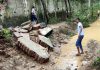 Debris lie on the ground after the boundary wall of an Army enclave collapsed due to heavy overnight rains, in Lucknow.