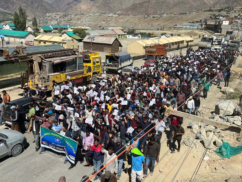 All Kargil Transport Association members taking out protest march at Kargil town on Tuesday. -Excelsior/Basharat Ladakhi All Kargil Transport Association members taking out protest march at Kargil town on Tuesday. -Excelsior/Basharat Ladakhi